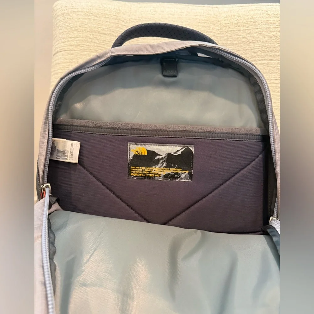 The North Face Gray and Black Backpack with Orange Logo